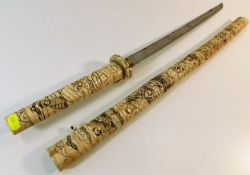 A Japanese carved bone Wakizashi style short sword