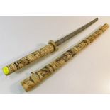 A Japanese carved bone Wakizashi style short sword