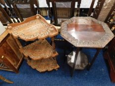 A two tiered table with carved decor to top 29.5in