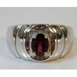 A 9ct white ring set with red stones 8.7g size T/U