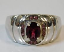 A 9ct white ring set with red stones 8.7g size T/U