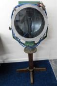 A large spotlight bearing brass plaque "Reconstruc