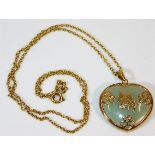 A 9ct gold chain & pendant set with jade & gold Or