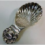A decorative silver caddy spoon 21.4g