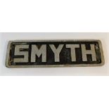 A solid cast alloy name plaque SMYTH 8.25in wide x