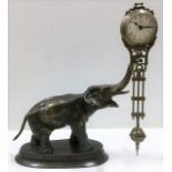 A German Junghans mystery swinger clock, 7.75in tall to top of elephant trunk