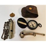 A small compass with case, a bosuns whistle, an L.C.C. (London County Council) "The Metropolitan" Ge