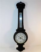 An oak banjo style aneroid barometer 36in high