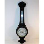 An oak banjo style aneroid barometer 36in high