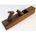 An antique wooden block plane