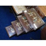 A nest of four Oriental style glass topped tables