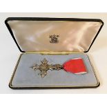 An unattributed, boxed MBE medal