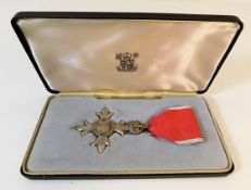 An unattributed, boxed MBE medal