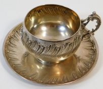 A decorative French silver cup & saucer 200g