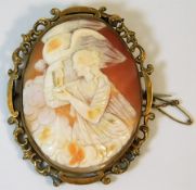 A yellow metal mounted cameo depicting bird of pre