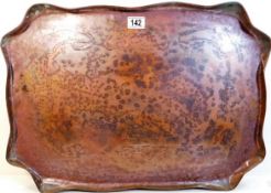 A large art nouveau copper tray with inscribed dec