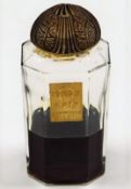 A French L'Aimant Coty perfume bottle with a Laliq
