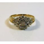 A yellow metal gold cluster ring set with 0.5ct di