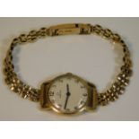 A ladies 9ct gold Omega watch with 9ct gold strap