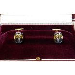 A pair of Asprey 18ct gold gents cuff links set wi