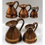 A set of five graduated antique copper haystack ju