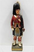 A model of a Scots Guard in uniform 14.25in tall.