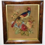 An early 19thC. raised work picture of parrot & fl