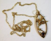 A 9ct gold 16in chain with bird pendant decorated