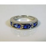 An 18ct white gold ring set with tanzanite & diamo