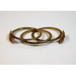 An unusual antique style three hoop yellow metal r