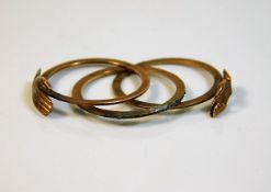 An unusual antique style three hoop yellow metal r
