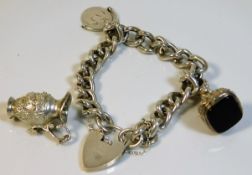 A silver charm bracelet 63.1g