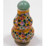 A Chinese porcelain snuff bottle with jade top 2.8