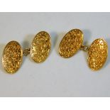 A pair of 18ct gold cufflinks with maple/ivy leaf