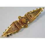 An antique yellow metal brooch 3.5g