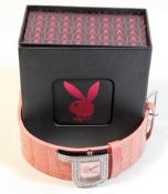 A boxed ladies Playboy wristwatch with Pink strap