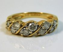 An 18ct gold ten diamond ring of approx. 1ct 4.5g size M/N
