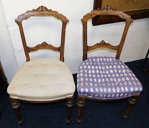 A pair of upholstered 19thC. carved walnut chairs