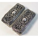 A pair of silver topped dressing table tidies, one