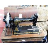 A cased Frister & Rossmann sewing machine