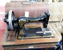 A cased Frister & Rossmann sewing machine