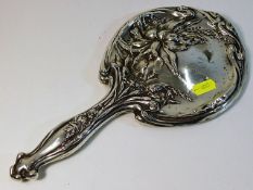 A decorative silver backed mirror, some faults 11.