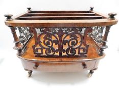 A decorative 19thC. walnut Canterbury with ceramic