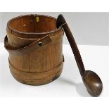 A wooden coopered bucket twinned with a 19thC. tre