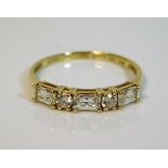 A 14ct gold ring set with white stones 2g size T