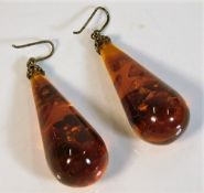 A pair of gilt mounted amber drop earrings 24.9g