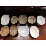 Nine antique ceramic jelly moulds