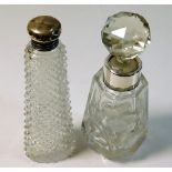 A silver topped scent bottle with hob nail glass t