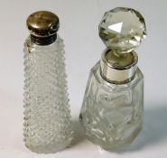 A silver topped scent bottle with hob nail glass t
