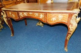 A Louis XV style tulipwood writing table with deco